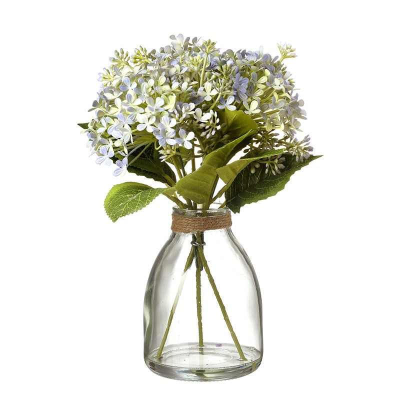 Pale Blue Flowers in Glass Vase