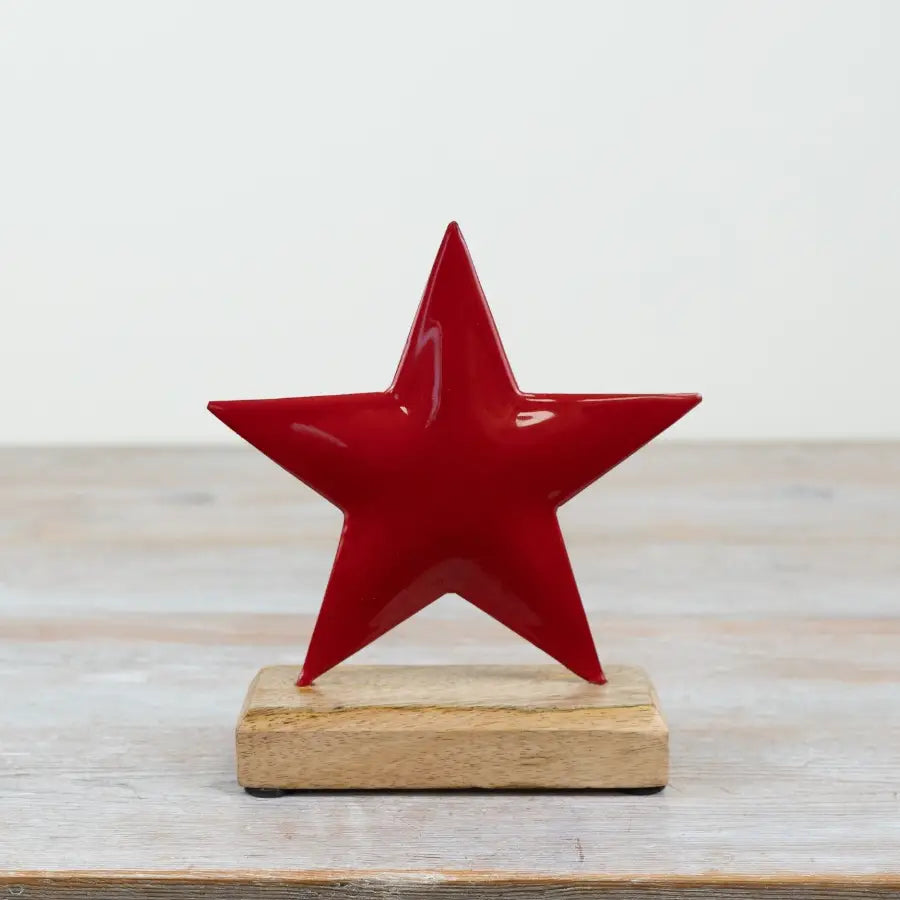 Red Iron Star On Wood Base