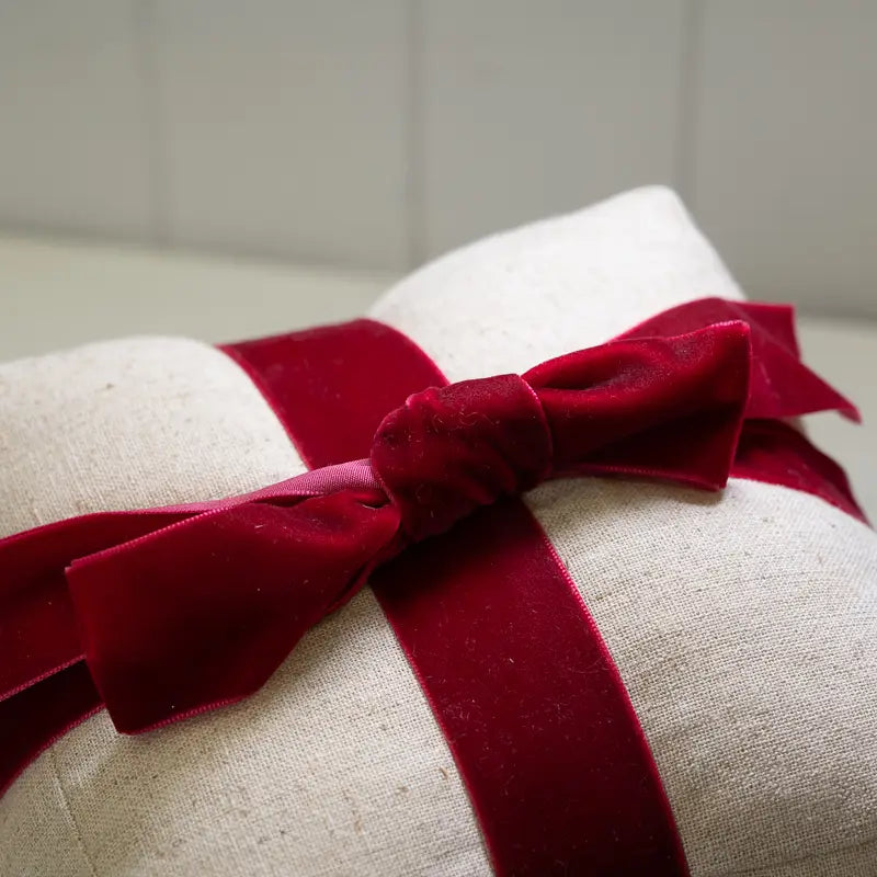 Natural Christmas Present Doorstop With Red Bow